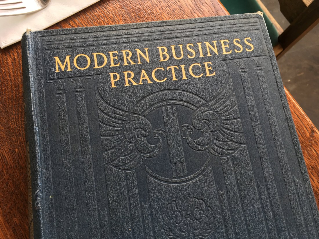 Old tattered book cover titled 