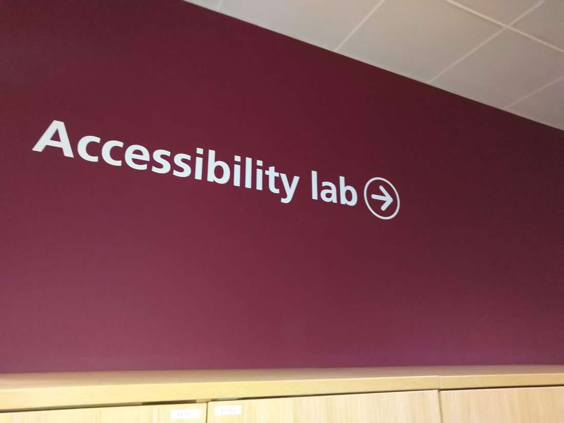 Lettering on wall: "Accessibility lab" with arrow pointing to right