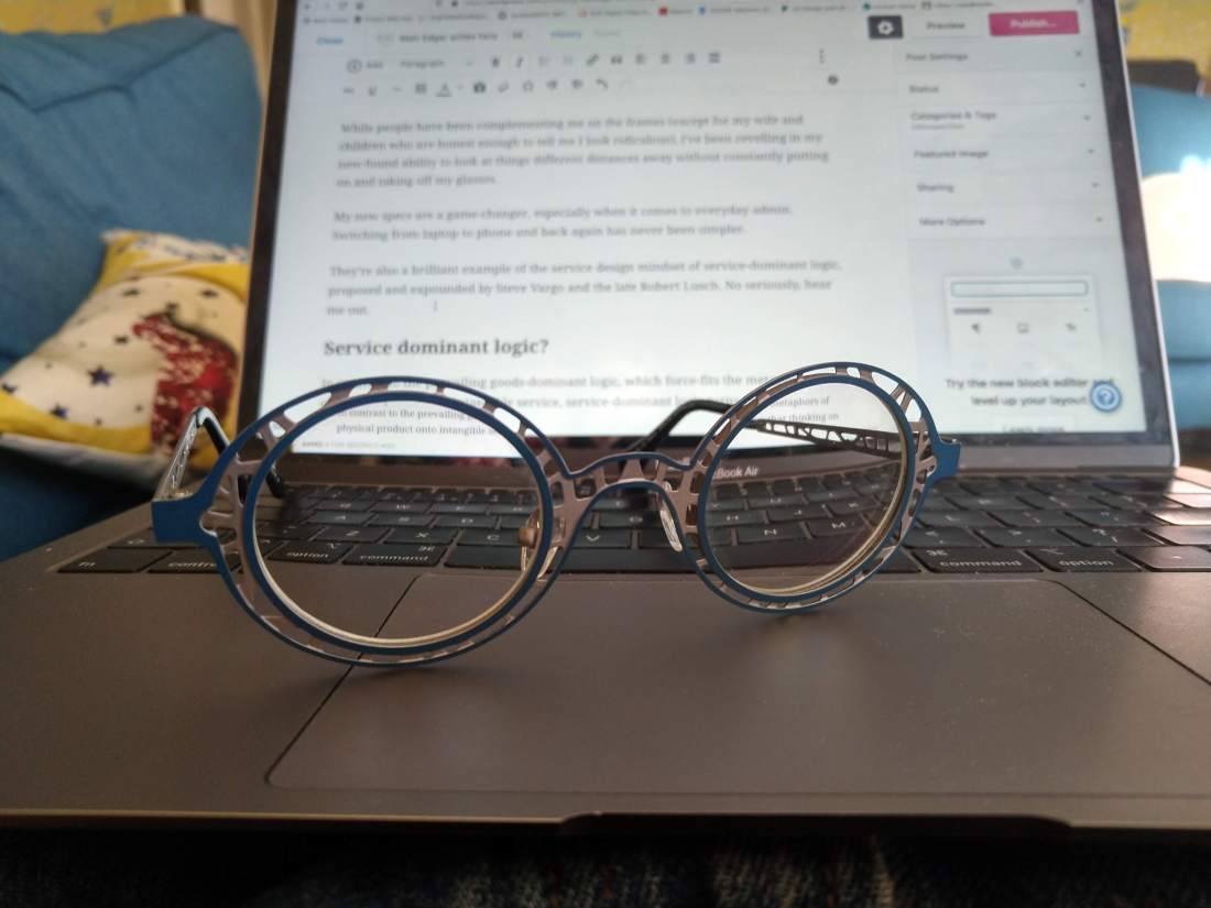 Glasses resting on laptop keyboard